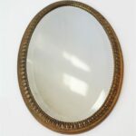 Miroir ovale métal doré