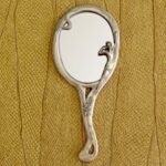 Miroir à main Statuette