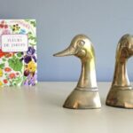 Serre livres laiton Canard